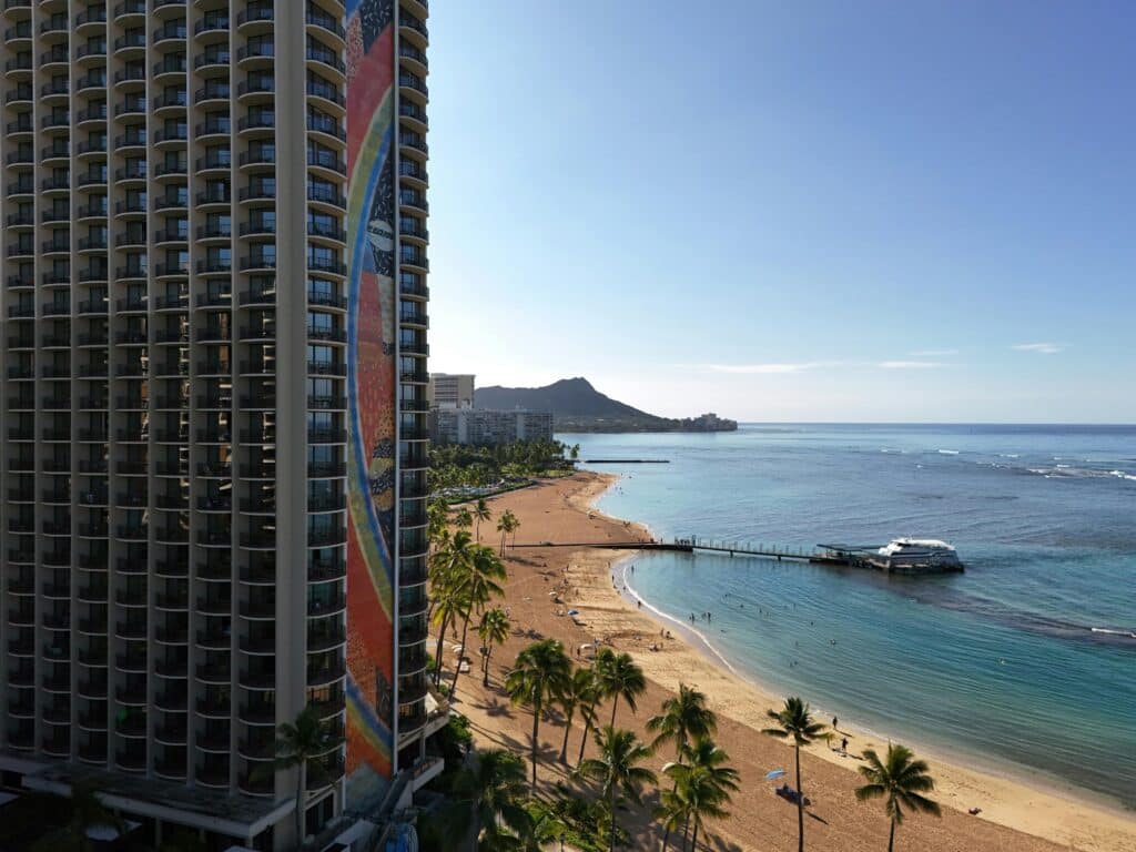 Aerial view of Waikiki Beach and Diamond Head with the iconic Hilton Hawaiian Village in Honolulu.